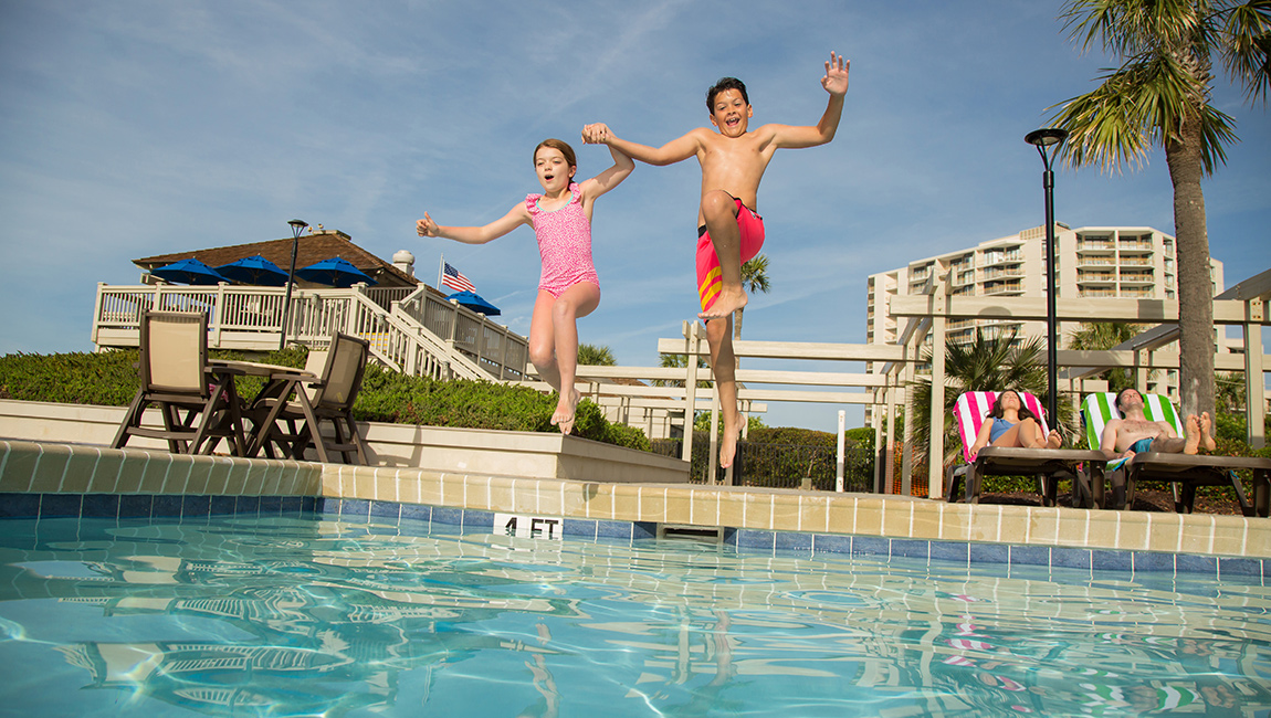 kids jump into pool
